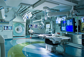 During intra-operative scanning, the MRI travels in and out of the operating room using ceiling-mounted rails to provide real-time images without moving the patient.