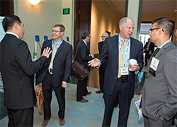 Attendees gather outside the exhibit hall at COSM 2015. 