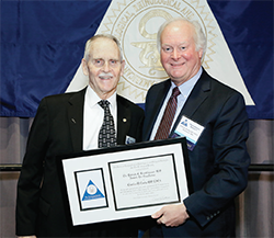 Dr. Luetje receives the Brookhouser Award from Trio President Dr. Beatty