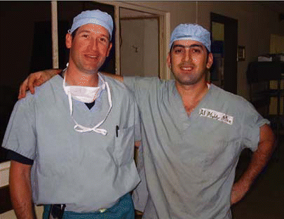 Figure. Major Charles J. Fox, MD (left) with Mohammed, the housekeeper of the 10th Combat Support Hospital, the most active combat hospital in Iraq.