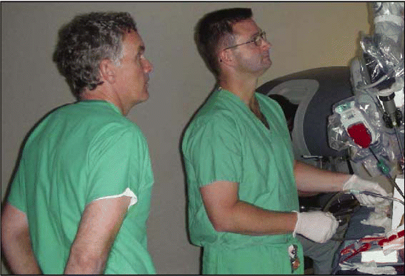 Figure. Drs. Bert O'Malley (left) and Richard Smith at a robotic surgery training course. Dr. O'Malley is currently working on adapting the robot to skull base surgery.