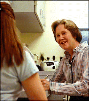 Figure. Pell Ann Wardrop, MD, discusses the option of home sleep testing with a patient.