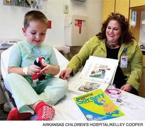 Child life specialist Camille Dante with patient Brayton Flournoy