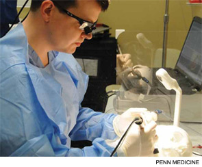 A resident practices simulated surgery of the temporal bone.