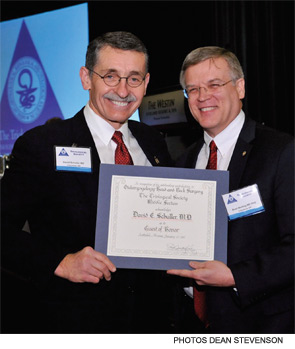 David Schuller, MD, accepting a Guest of Honor award from D. Bradley Welling, MD, PhD.